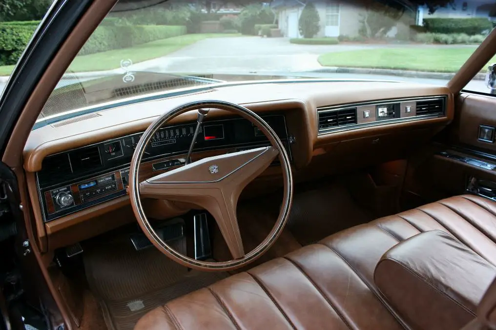 The luxurious interior of the 1973 Cadillac Coupe DeVille was designed to provide ultimate comfort and style for its occupants.