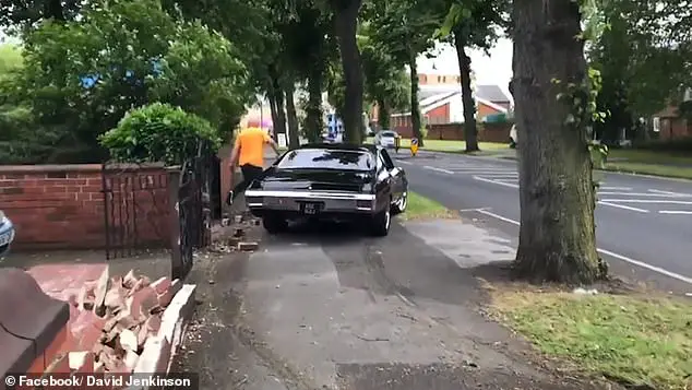 Tyre marks are visible on the pavement next to the crumbling brick wall after the crash outside the Classic Car and Bike Show in Doncaster on Sunday