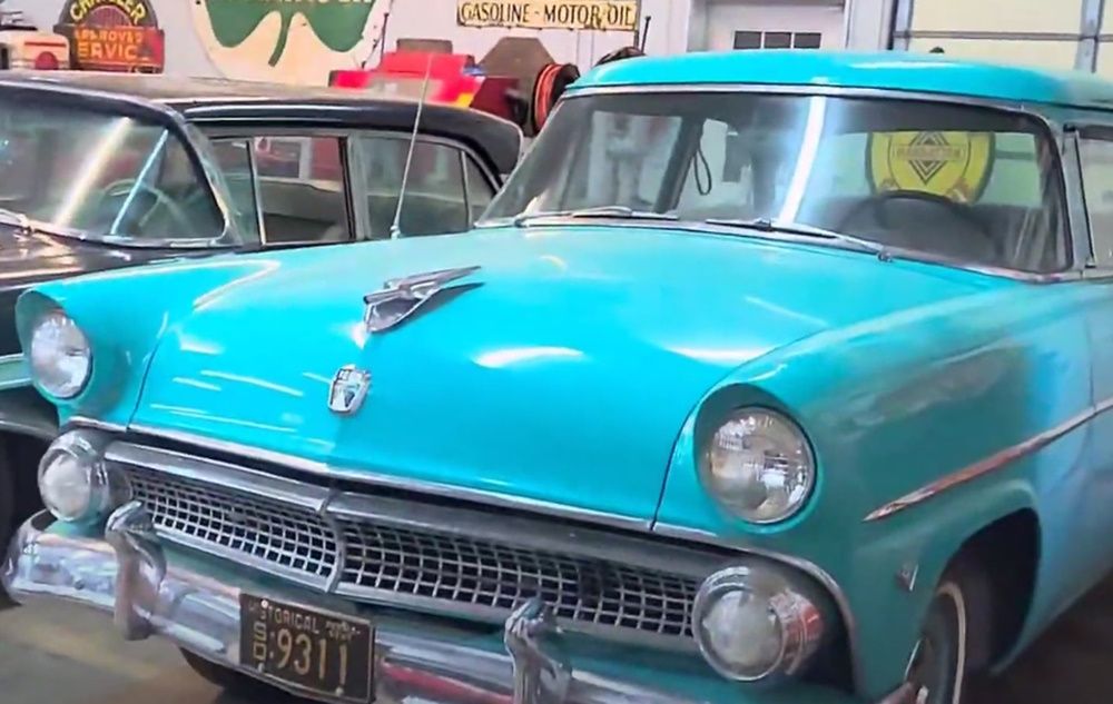 A 1955 turquoise Ford Customline