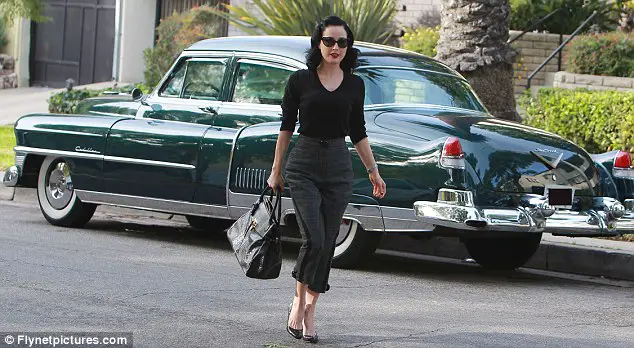 Retro: Burlesque performer Dita Von Teese arrives for an appointment in Los Angeles on Wednesday in a classic Cadillac