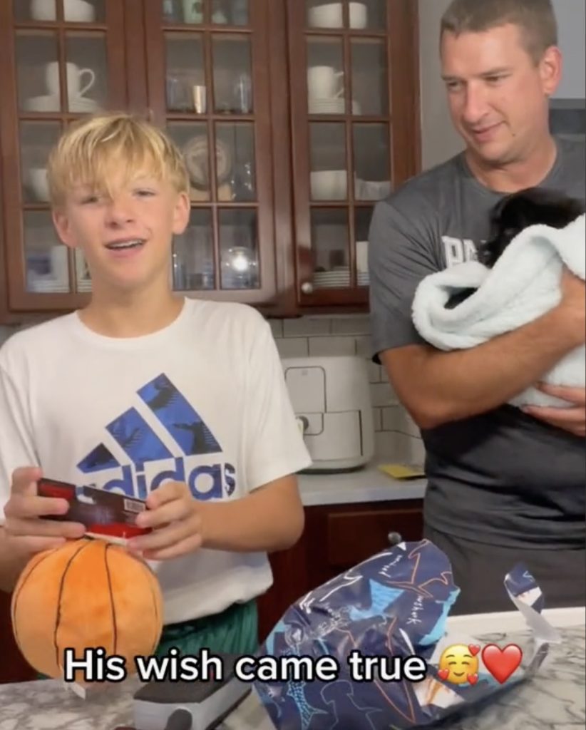 boy surprised with puppy