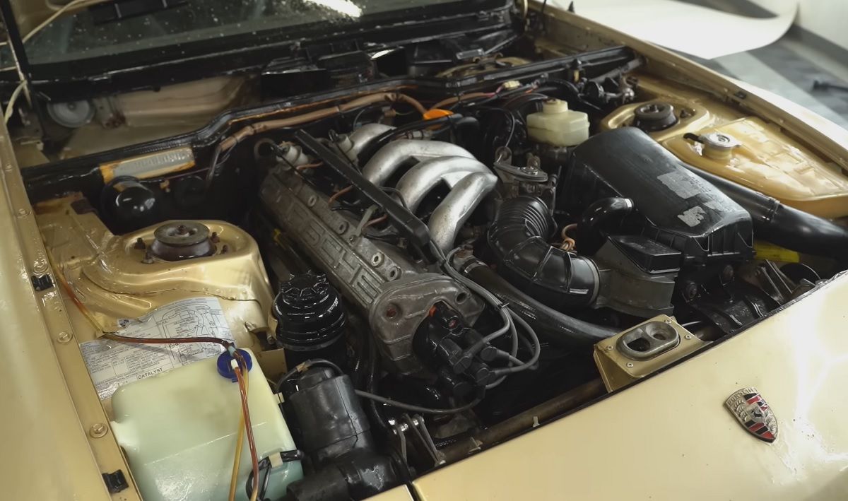 Gold Porsche 944 Engine Being Cleaned